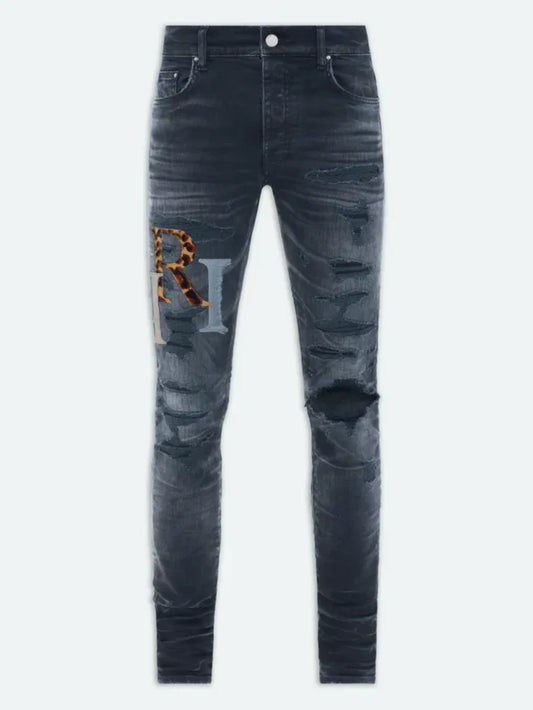 AMIRI STAGGERED LOGO JEANS INDIGO